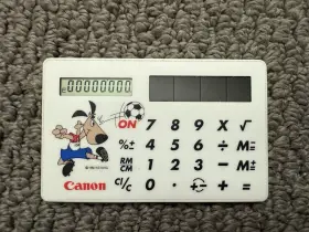 LS-718 CANON Solar Card Calculator Cup Fifa Striker Mascot