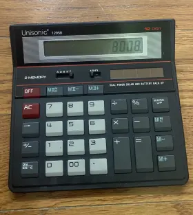 1295B UNISONIC Calculator Dual Power Solar Battery Backup