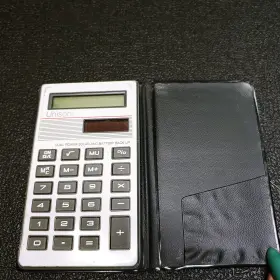LC-374 UNISONIC Dual Power Solar Battery Up Pocket Calculator