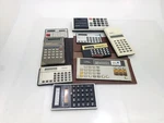 Lot Of 8 Vintage Calculators Canon, Sharp, Unisonic, Casio. Fixed Price $21.99.