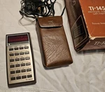 1976 Texas Instruments Ti-1450 Calculator Working With Adapter & Case. Fixed Price $8.89.