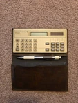 Vintage 1986 Texas Instruments Ti-2200ii Calculator Gold With Brown Cover. Fixed Price $12.99.