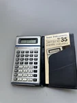 Texas Instruments Calculator T1-35 With Case And Manual. Fixed Price $30.00.