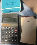 Sharp El-322 Vintage Checkbook Calculator With Case, Box, And Manuals. Fixed Price $35.00.