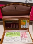 Vintage 1970s Unisonic Lc-222a Calculator Wallet. Fixed Price $49.00.