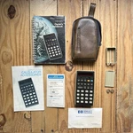 Vtg Hp 25 Hewlett Packard Calculator W/ Owner's Handbook Case Guide Etc Works. Fixed Price $237.49.