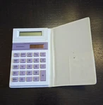 Unisonic Dual Power Solar & Battery Backup Tilt-up Calculator W/ Case Taiwan Psj. Fixed Price $10.00.