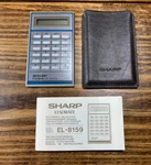 Sharp Elsimate El-8159 Miniature Calculator With Case And Manual. Fixed Price $15.00.