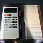 Vtg Unisonic Cb-14 Pocket Calculator Green Vacuum Fluorescent Display W/cover. Fixed Price $11.87.