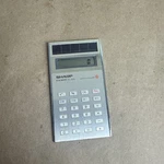 Vintage Sharp Elsi Mate El-835 Solar Cell Calculator In Velvet Sleeve Japan 1981. Fixed Price $13.25.