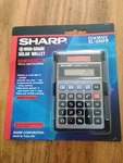 New In Package Sharp El-326fb Calculator Solar Powered Vintage W/ Wallet. Fixed Price $29.00.
