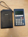 Vintage Sharp Elsi 8107 Calculator W/ Case & Strap Green Display Tested Work. Fixed Price $29.99.