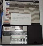 Sharp Pc-1250a With Books, Charger, And More. Fixed Price $70.00.