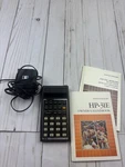 Vintage Hp 31e Calculator With Charger & Owners Handbook. Fixed Price $199.00.