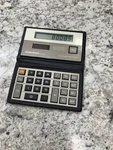 Vintage Radioshack Solar Powered Pocket Calculator Model Ec-426 Wallet Style. Fixed Price $12.99.