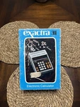 Texas Instruments Exactra 31 Electronic Calculator Ex-31 Complete With Manual. Fixed Price $49.99.