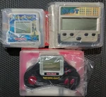 Radio Shack (three) *new* Handheld Games. Fixed Price $40.00.