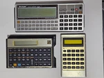 Lot Vintage Calculators: Sharp Pc-1350 + 8k Ram, Hp 12c And Ti-1750. Fixed Price $86.00.