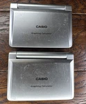 2 Casio Fx-9860g Slim Graphing Calculator - Compact Size (some Minor Scratches). Fixed Price $90.00.
