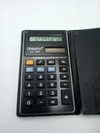 #l) Unisonic Solar Power Calculator Lc-384 - Battery Back Up Clean Display Works. Fixed Price $8.00.