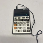 Vintage Casio J-3 Electronic Calculator Model J-1211 With Adapter. Fixed Price $31.99.