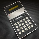 Sharp Elsi Mate El-8019 Brown Pocket Folding Calculator Made In Japan 3"x 3". Fixed Price $32.99.