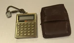 Zykkor Micro Calculator Gold Finish Key Chain. Fixed Price $18.00.