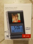 Brookstone Digital Photo Clock 1.4 Inch Lcd, Brand New. Fixed Price $18.00.