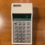 Vintage Radioshack Memory Ec-243 Calculator With Protective Case. Fixed Price $8.00.
