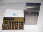 2 Vtg. 1970s Mini Calculators 1 Sharp, Amer. Ex. Gold Credit Card Size.. Fixed Price $50.00.