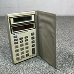 Vintage Texas Instruments Ti-1006 Light Powered Calculator With Case. Fixed Price $12.98.